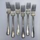 Set of 12 soup spoons and 6 silver-plated lunch forks.
