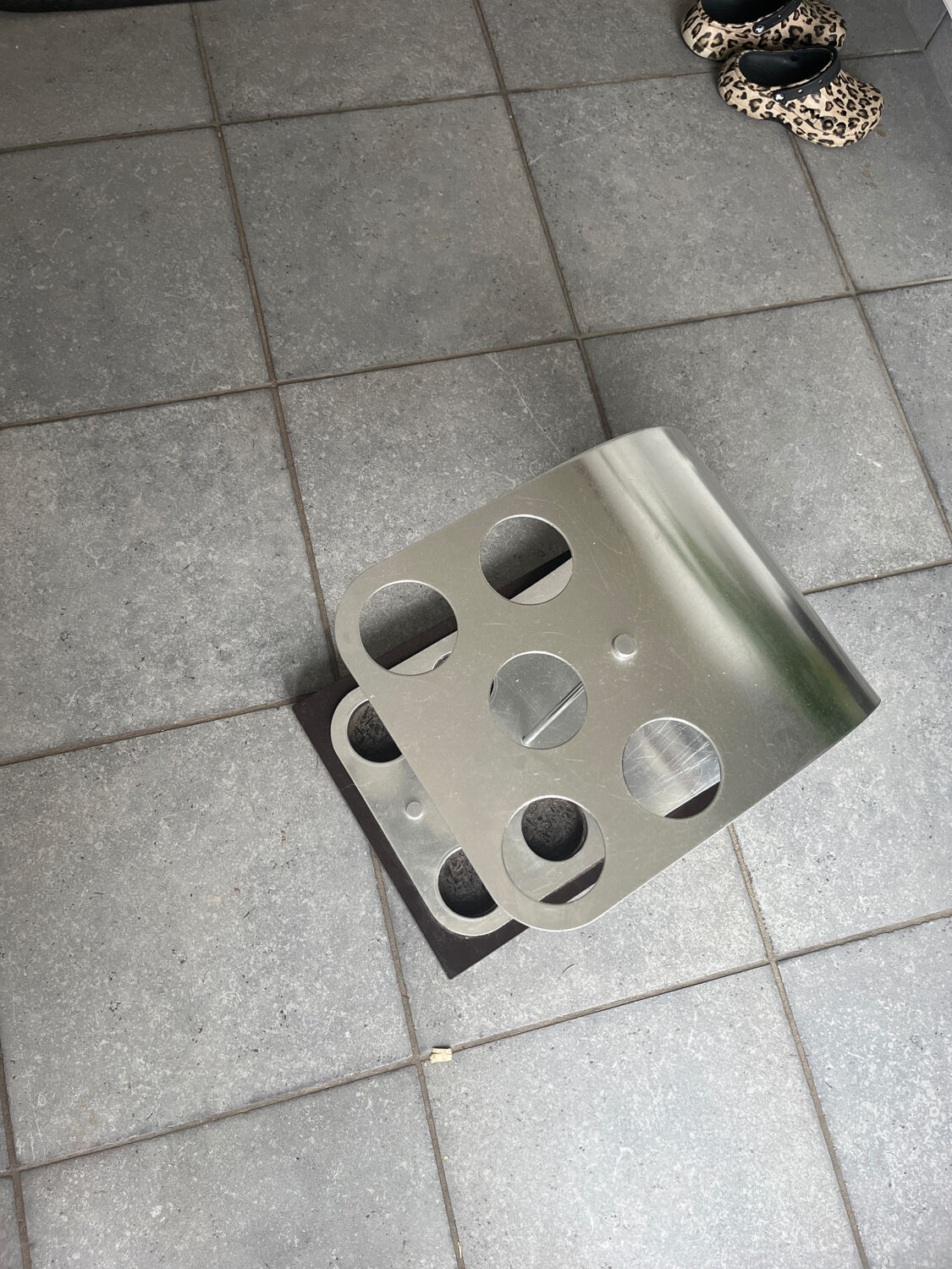 A modernist ebonised and aluminium umbrella stand