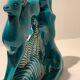 Pair of art deco bookends in enamelled ceramics, doe and hunting dogs