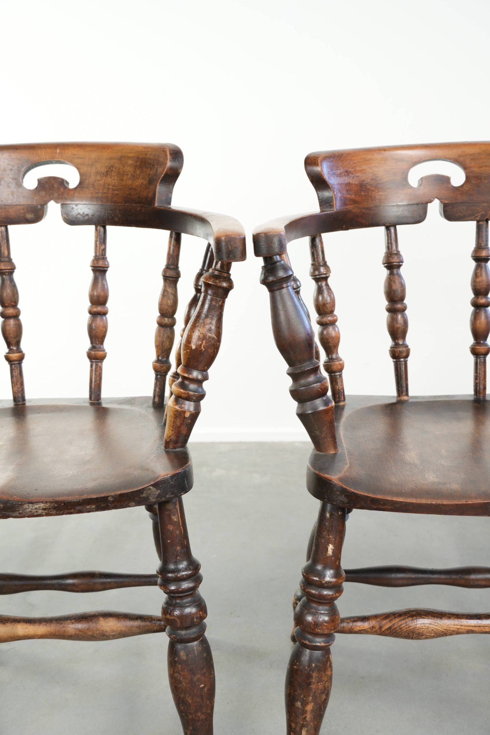 Set of four wooden English antique pub/captain chairs from the 19th century