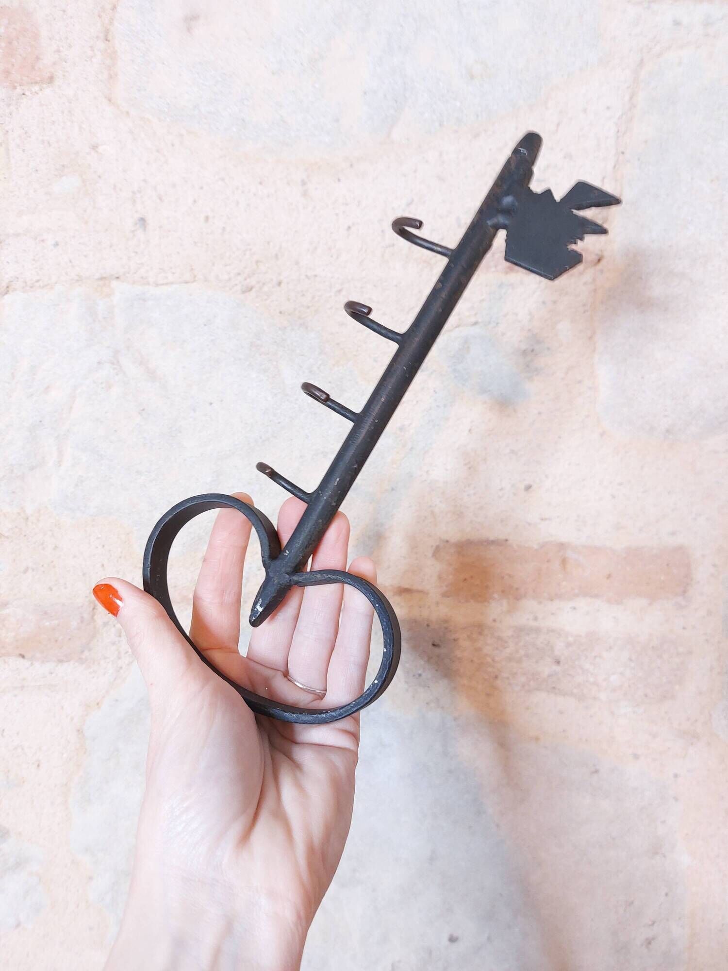 Old wall key holder in the shape of a vintage metal key 4 hooks