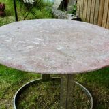 Round marble table with chrome base.