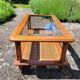 Coffee table in cherry wood, glass and caning.
