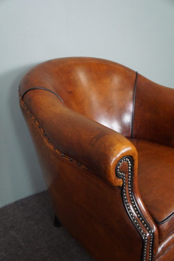 Leather club chair with black piping