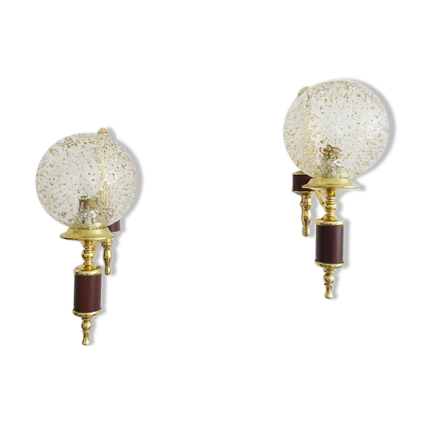 Golden wall lamps with round glass shades and teak veneer
