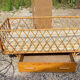 Child rattan bed with removable barrier
