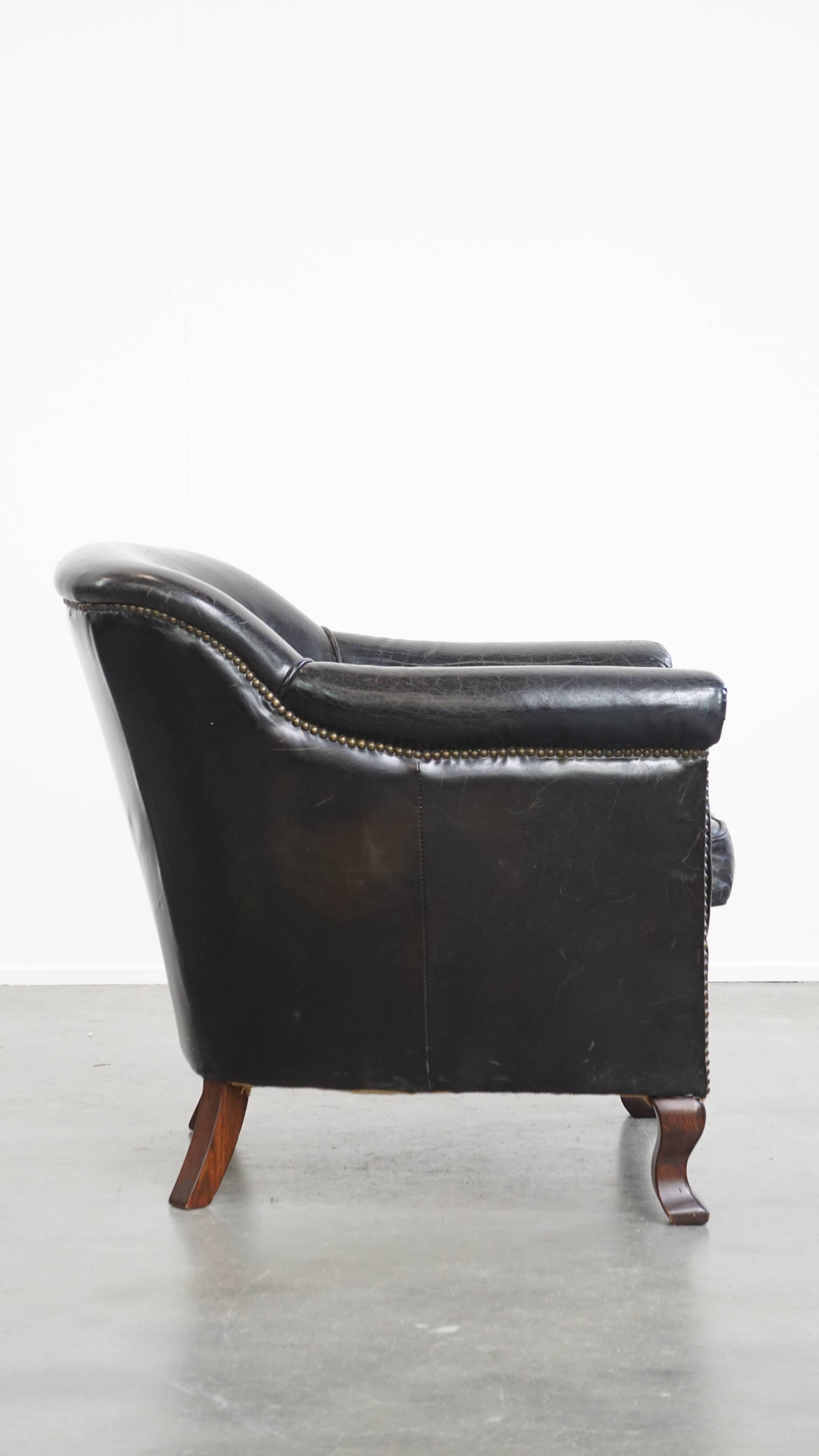 Black cowhide leather armchair