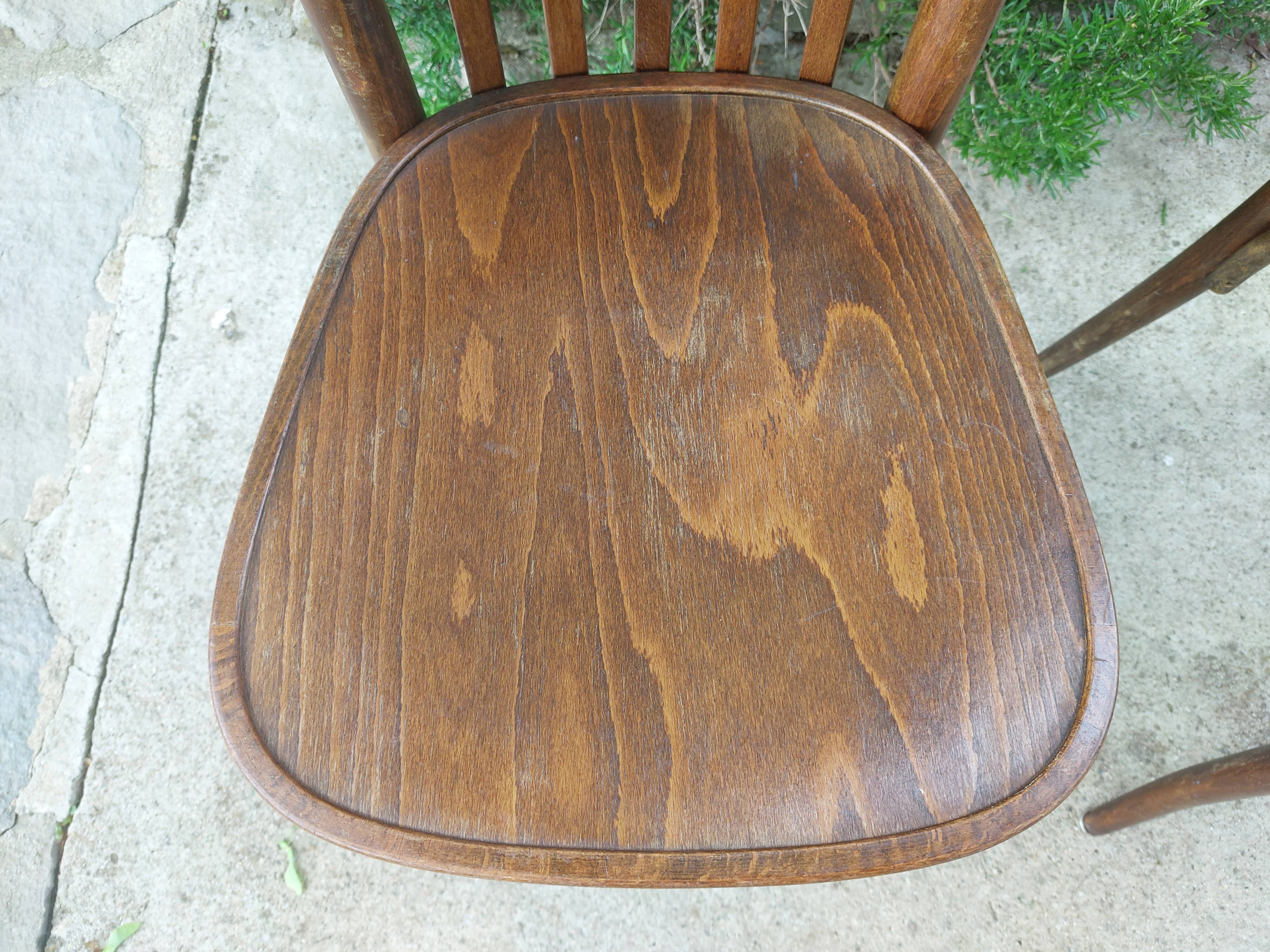 pair of dark bistro chairs, rounded backs, Baumann style