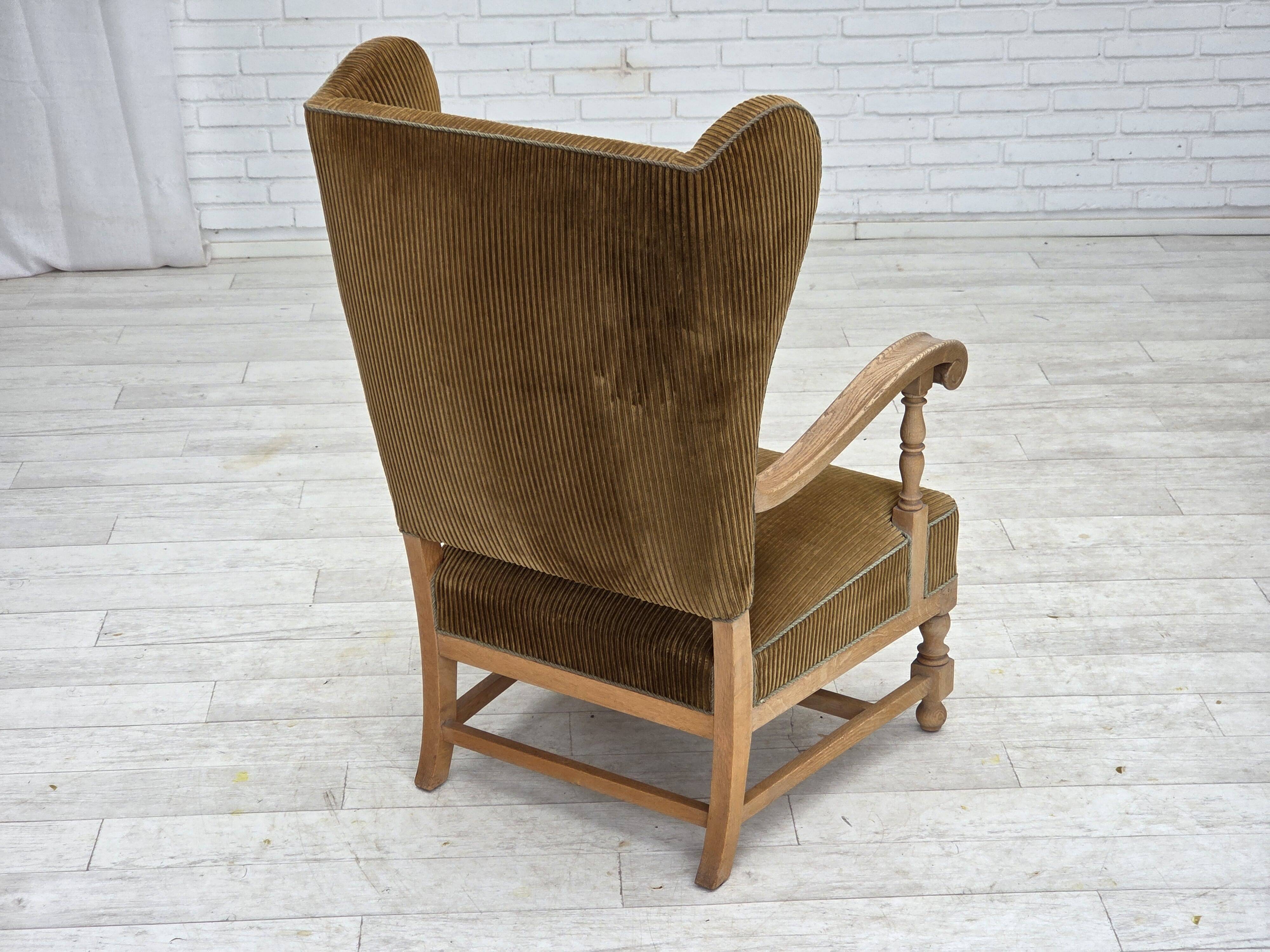 1970s, Scandinavian highback armchair, furniture corduroy, carved oak wood.