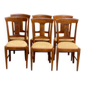 6 Syriel solid cherry wood dining chairs with yellow fabric.