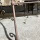 Old wrought iron table and its armchairs and chairs for outdoor use.