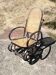 Vintage Thonet rocking chair in cane and bent wood.