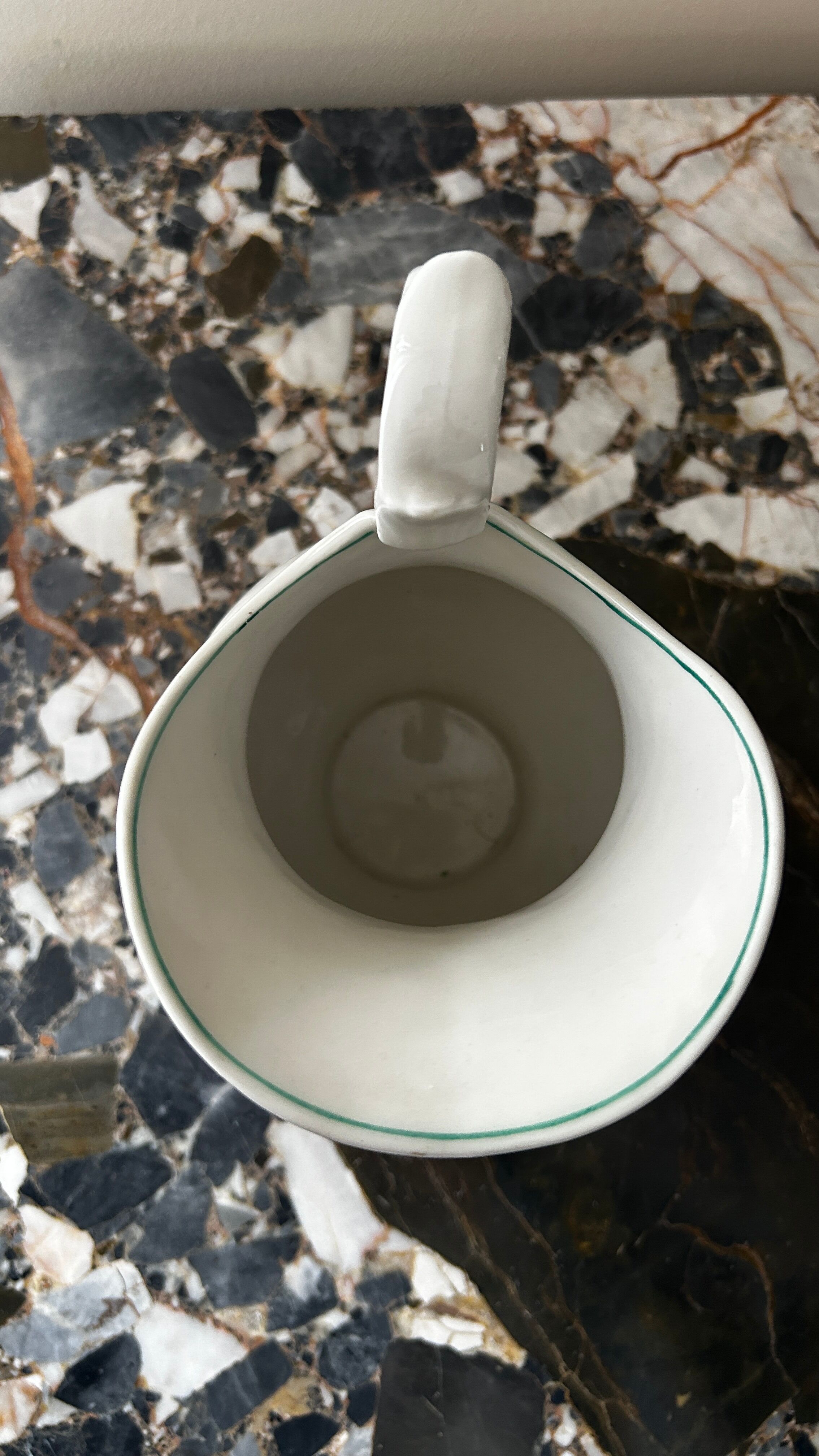White toilet jug with green trim