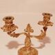 Old candle holder in gilded bronze