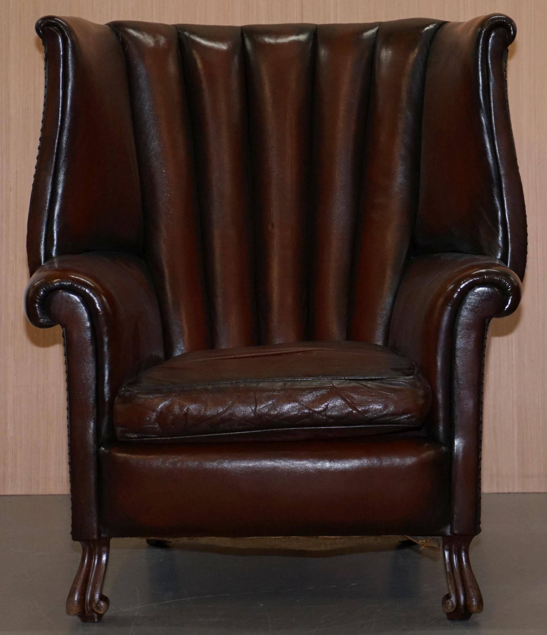 Victorian leather canapé and armchair, barrel back, circa 1860, restored.