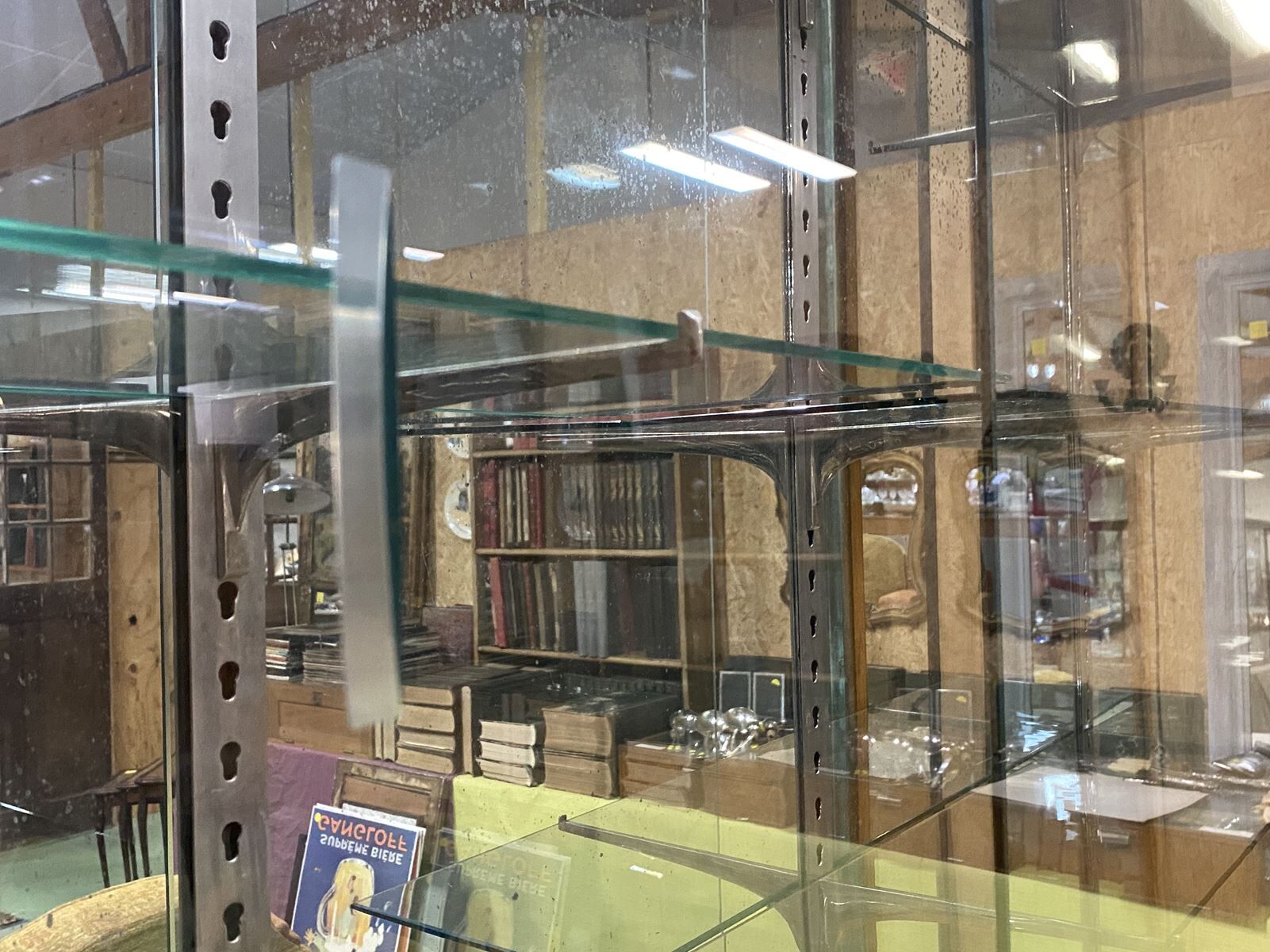 Store window with sliding doors in matte black patinated oak - 30s