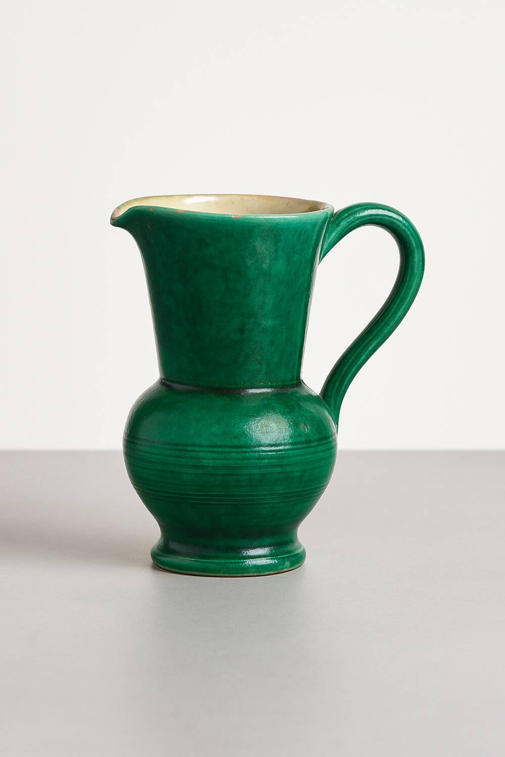 Green glazed ceramic carafe