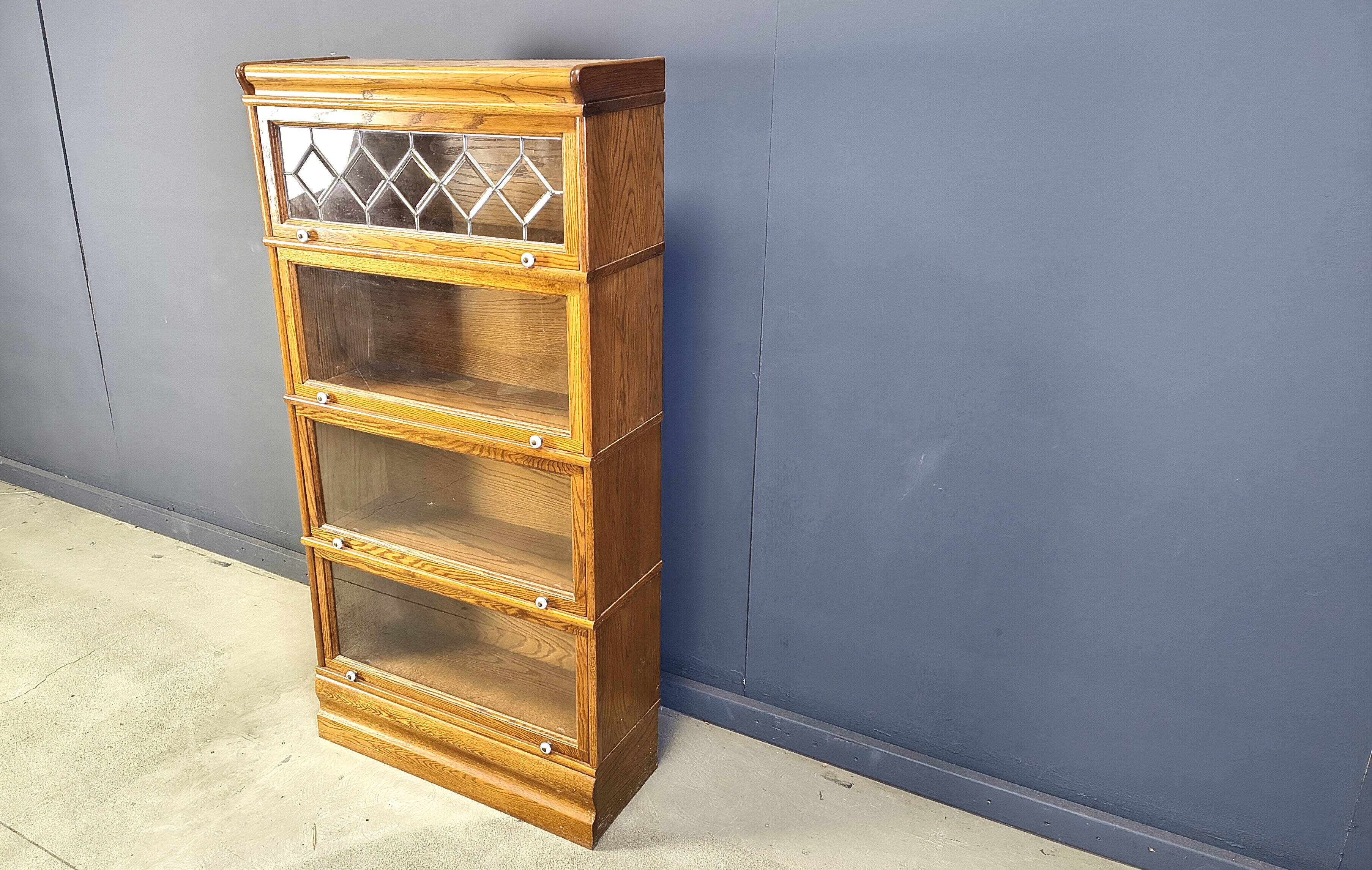 Four tier oak barrister style bookcase with leaded glass