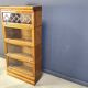 Four tier oak barrister style bookcase with leaded glass