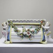 Small porcelain planter in antique German Putti style Meissen from the 19th century.