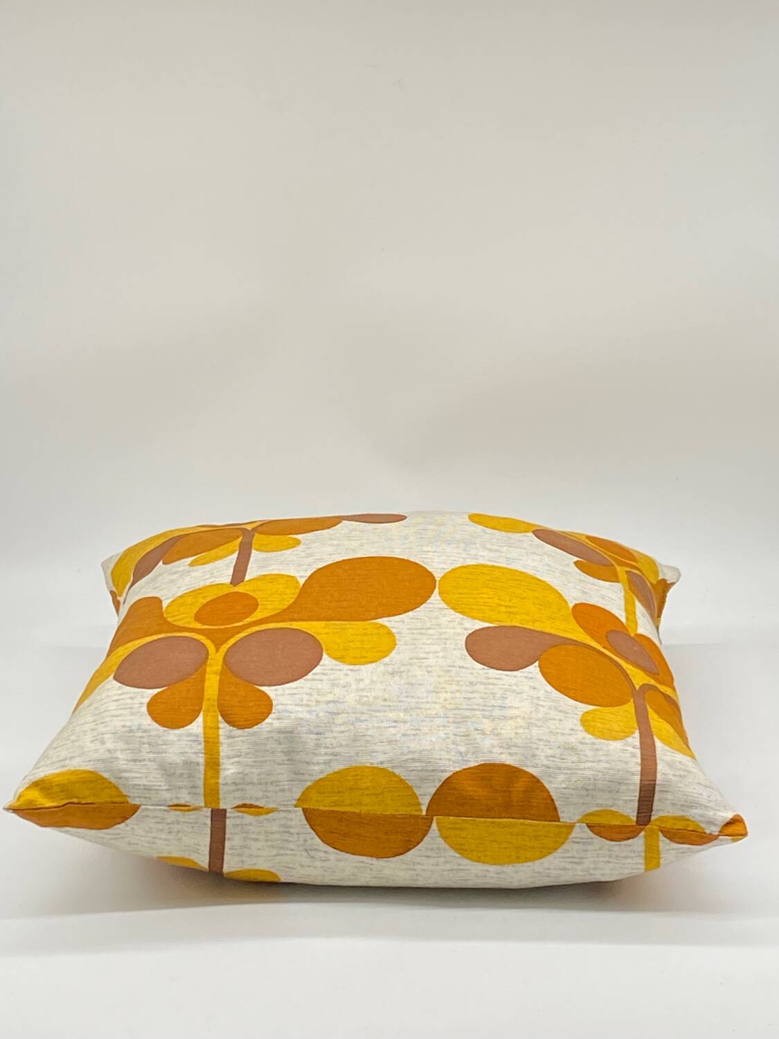 Vintage orange/brown cushion with stylized flowers