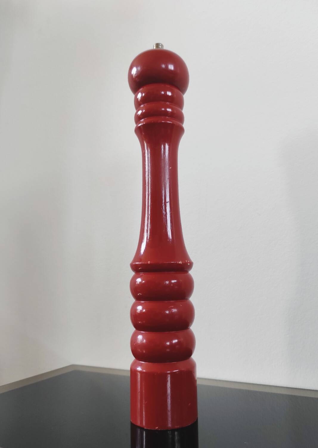 Giant vintage red lacquered wooden pepper mill