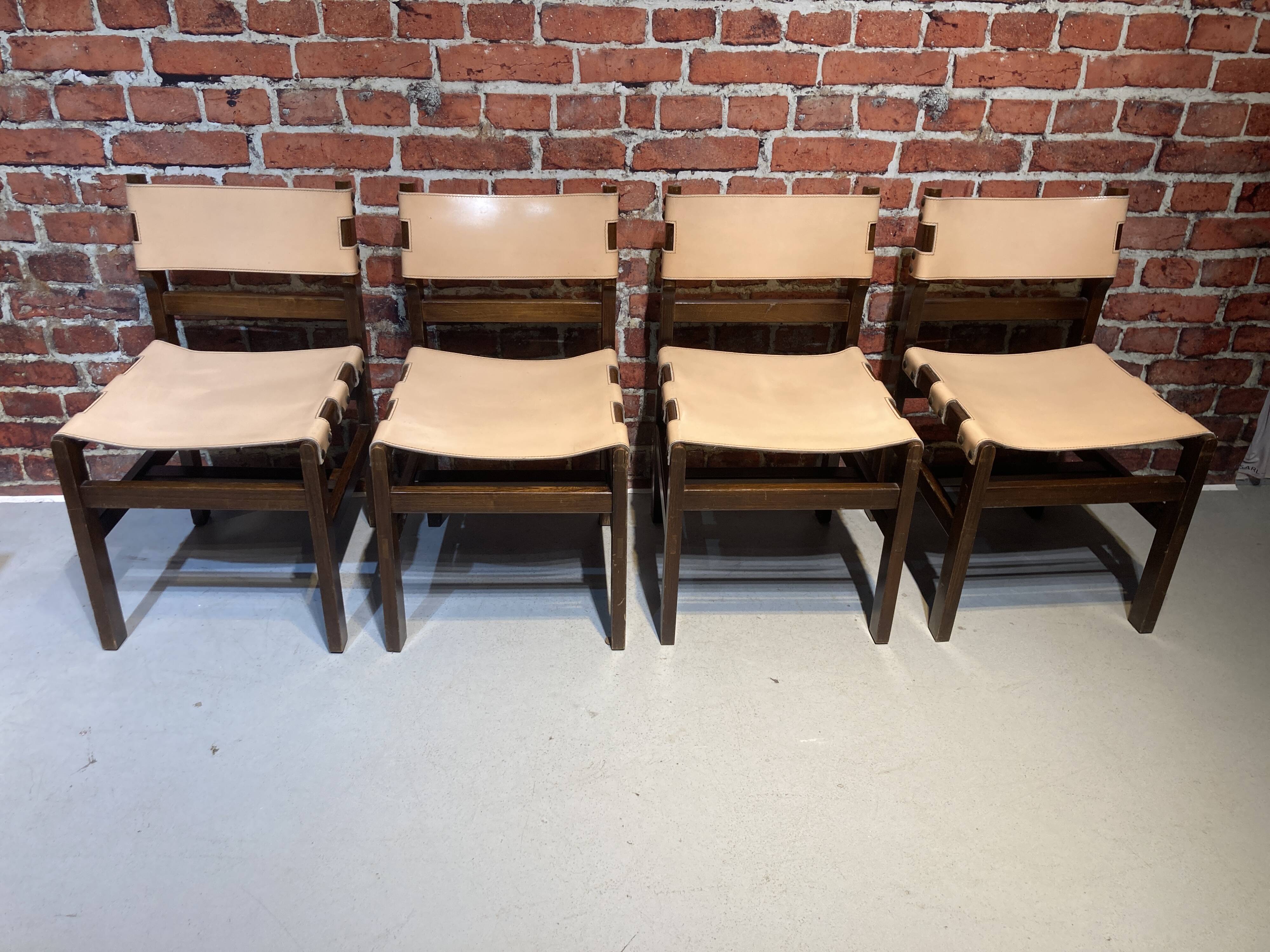 Set of four wooden and leather chairs from Maison Regain