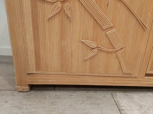 Vintage wicker sideboard with flowers