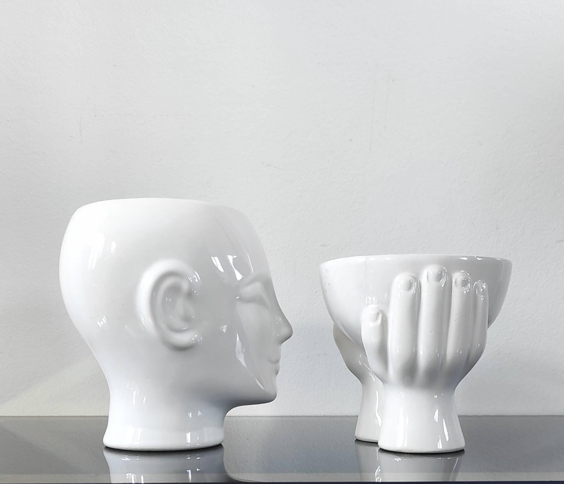 A pair of vintage ceramic plant pots.