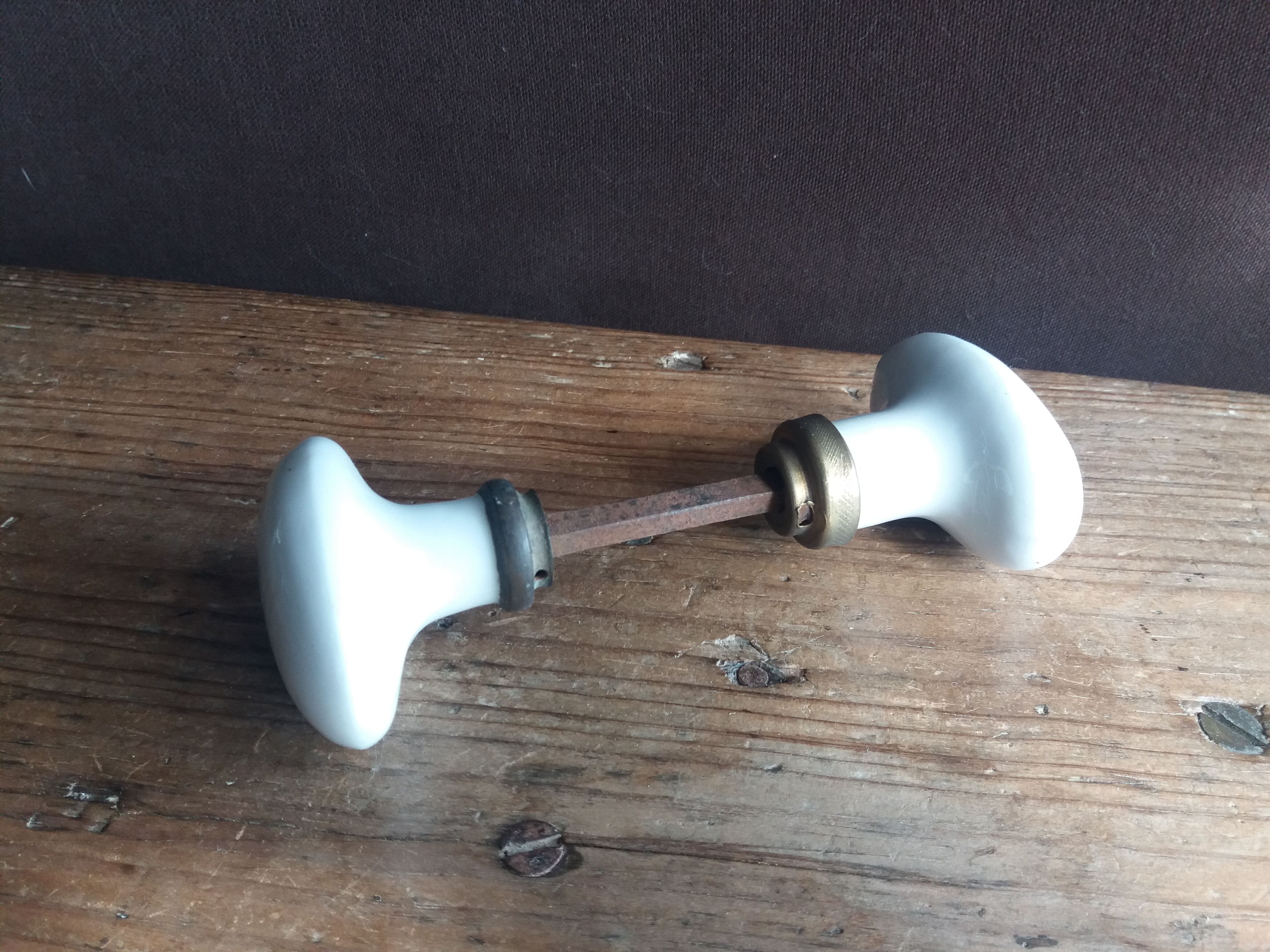 White porcelain door knob handles