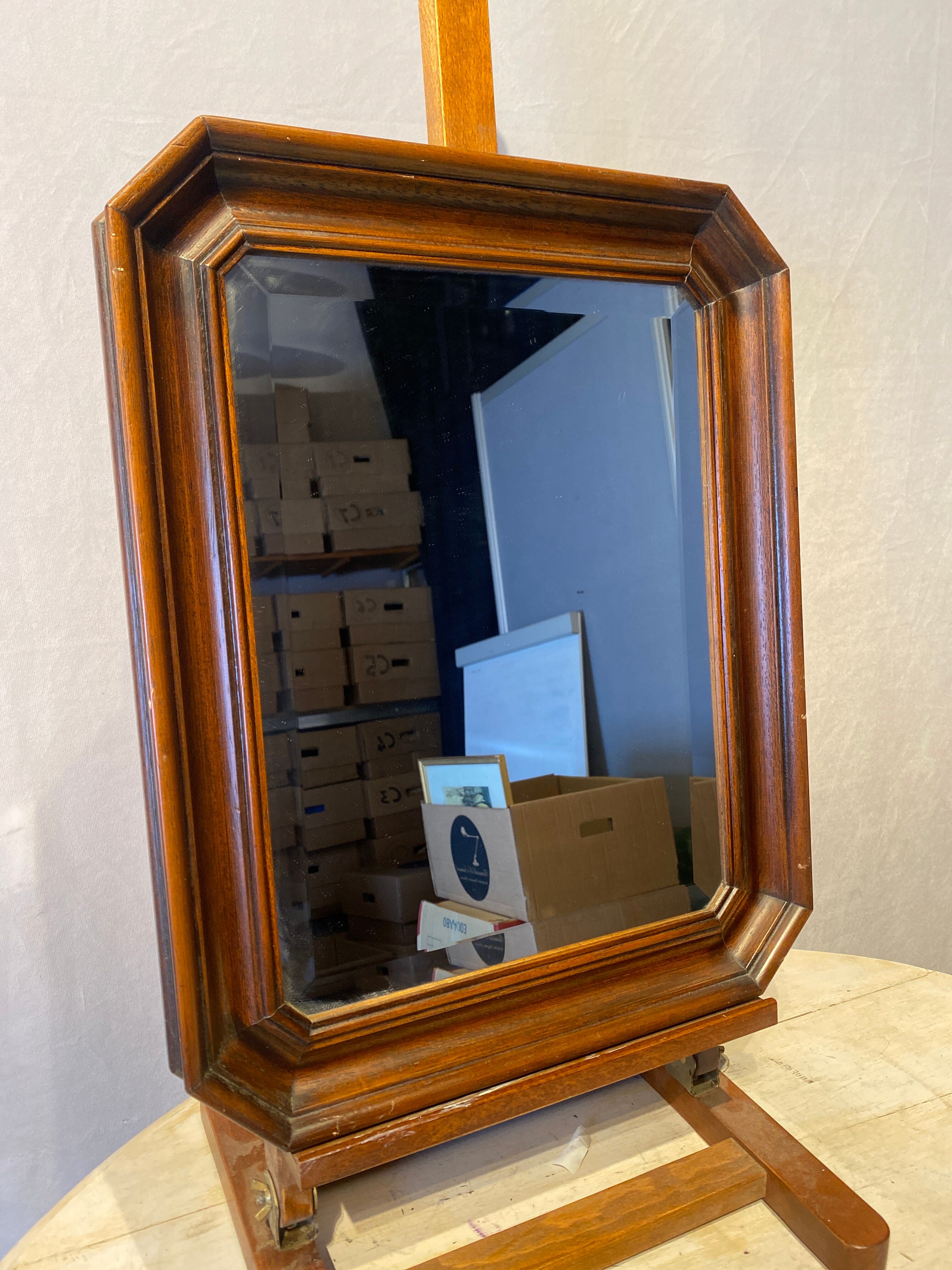 Beveled mirror in its wooden frame