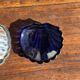 Vintage silver-plated shell butter dish with blue bowl.