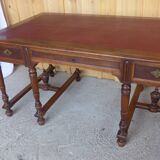 Flat walnut desk with eight feet turned