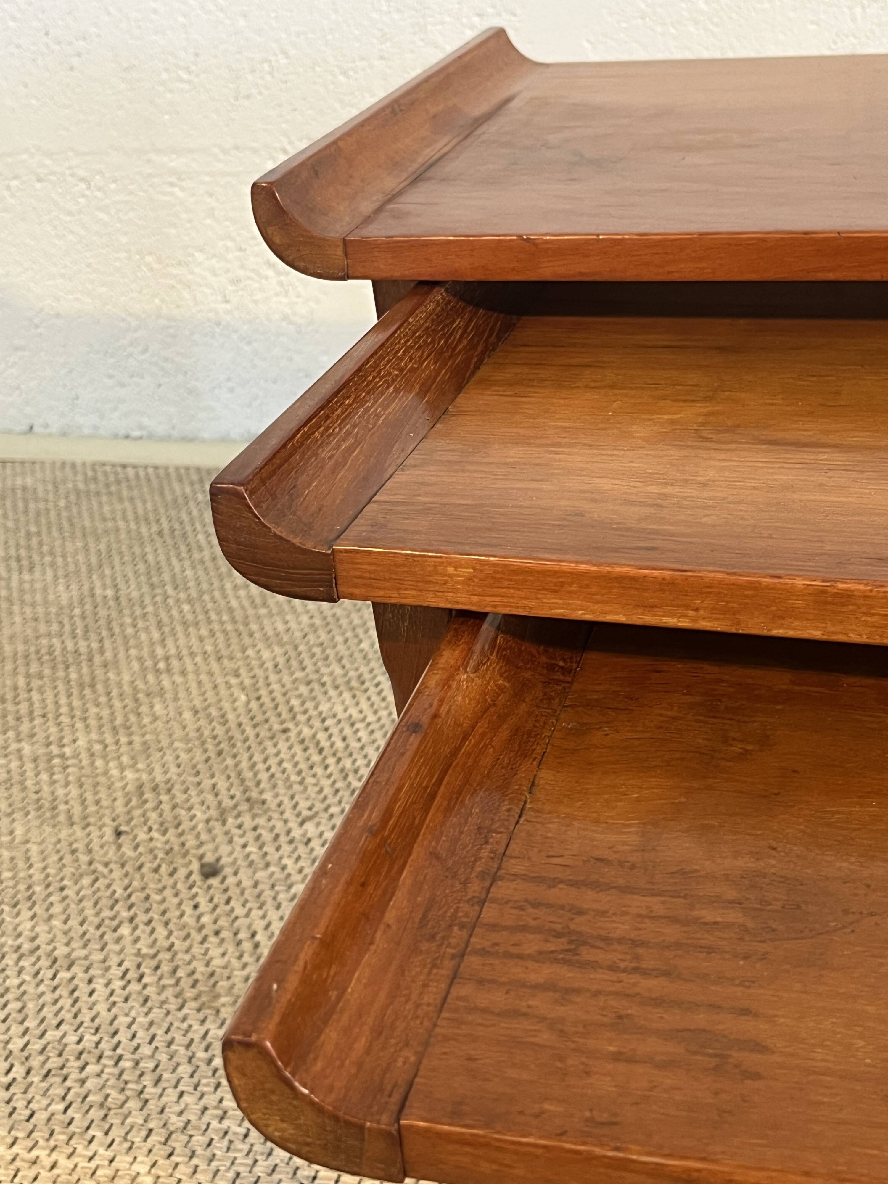 Set of three nesting low tables in a Japanese style, made of mahogany.