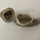 Porcelain figurine snail and its small