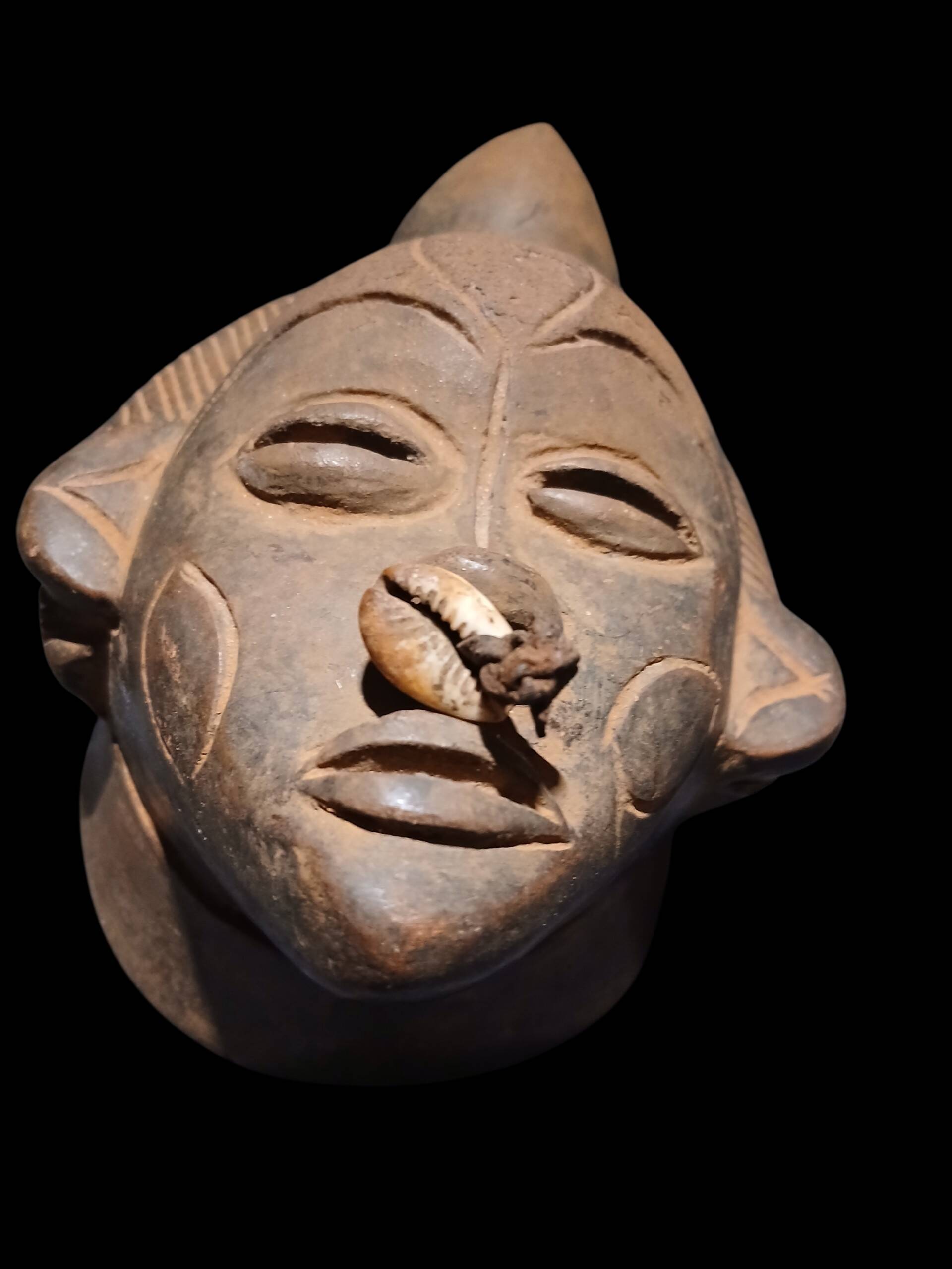 Terracotta mask from the Punu people of Gabon.