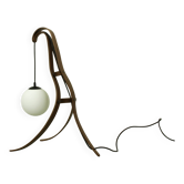 Sculptural table lamp with globe