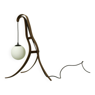 Sculptural table lamp with globe