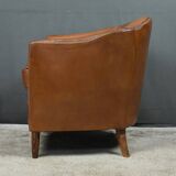 Solange club armchair in sheepskin leather.