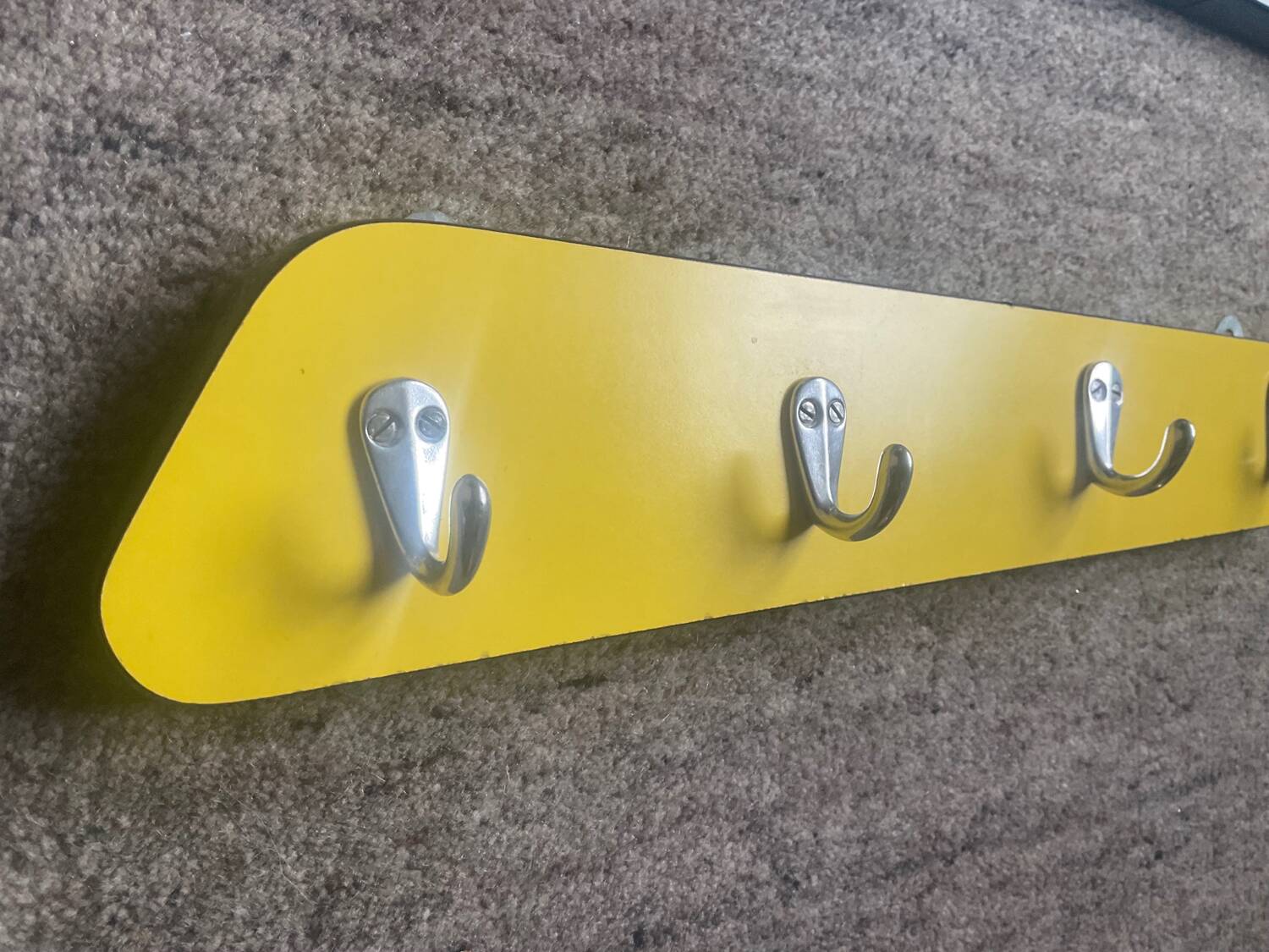 Duo of asymmetrical Formica coat racks from the 60s