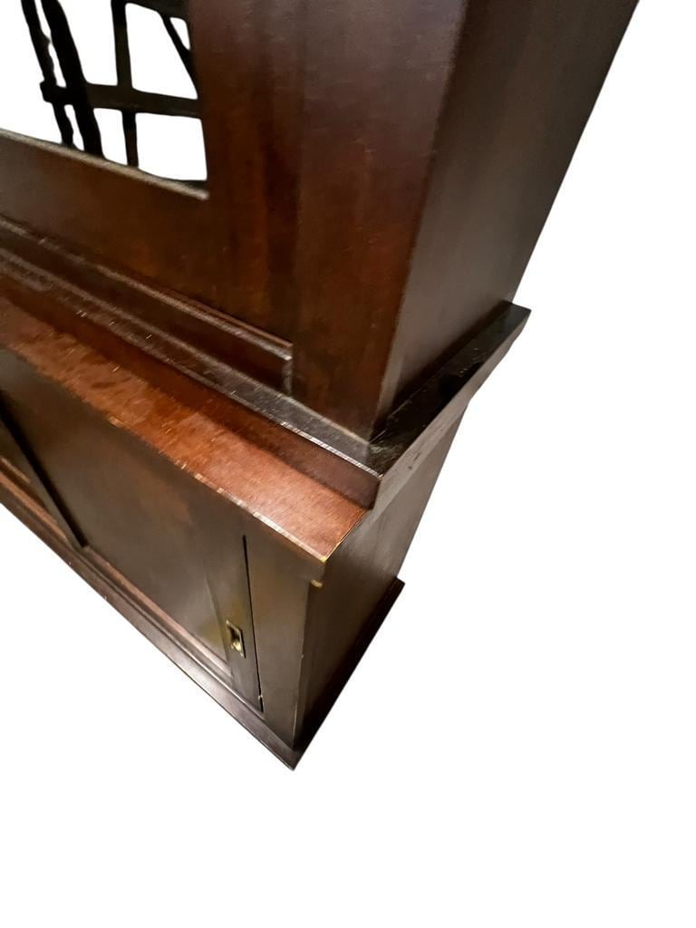 Vintage wooden display cabinet with sliding doors.