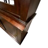 Vintage wooden display cabinet with sliding doors.