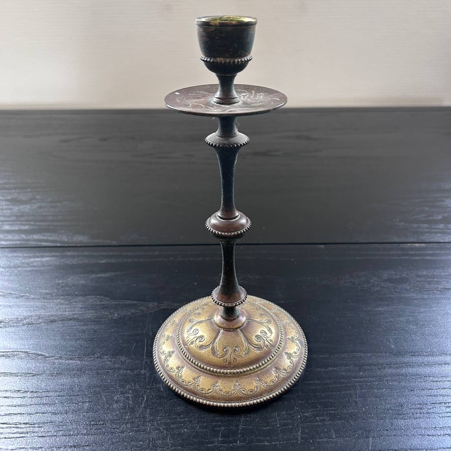 Chiseled brass candlestick