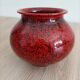 Red and black ceramic vase or pot cover
