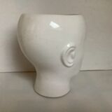 Man's head hide pot vase