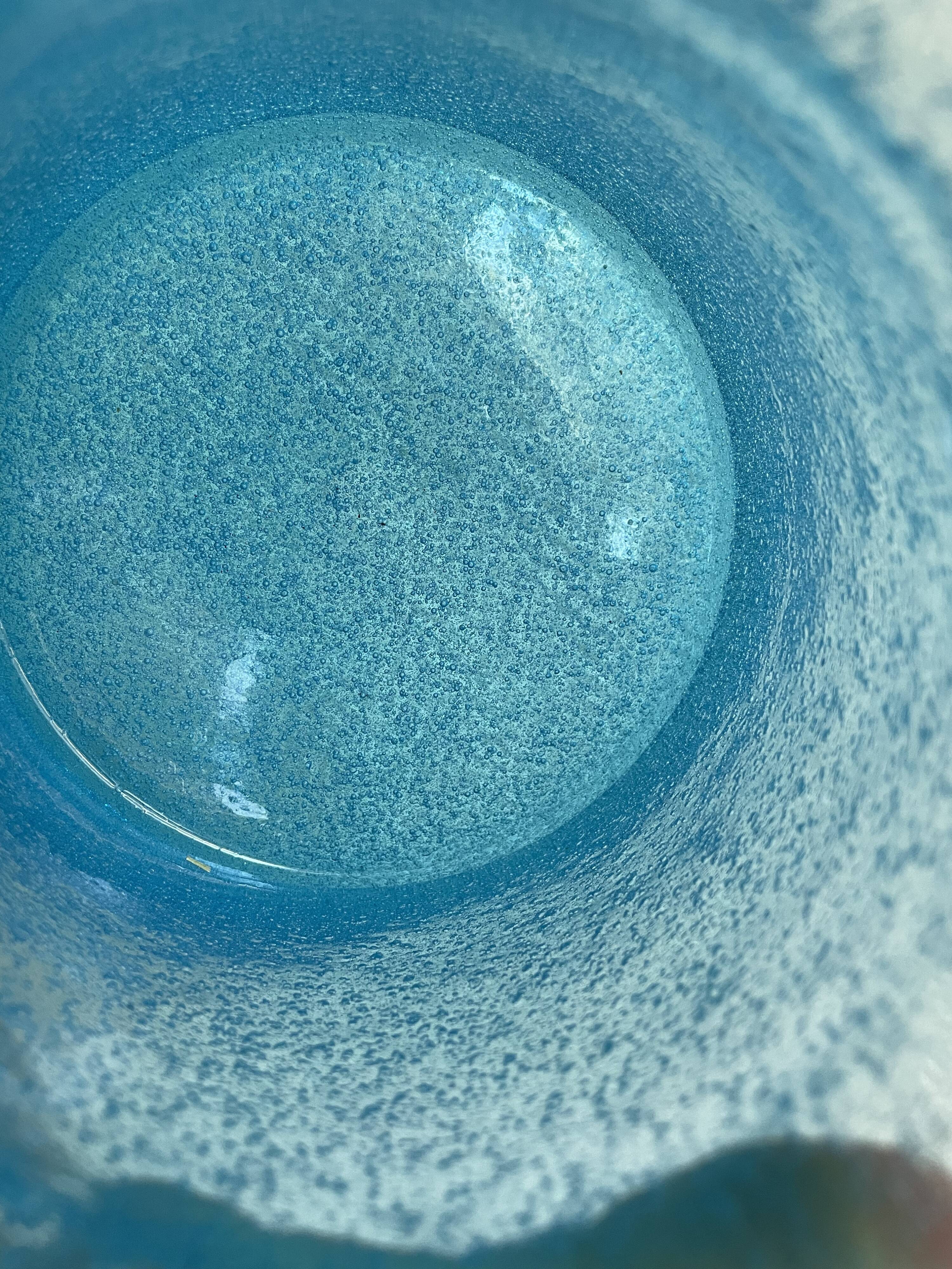 Blue glass vase with encrusted bubbles