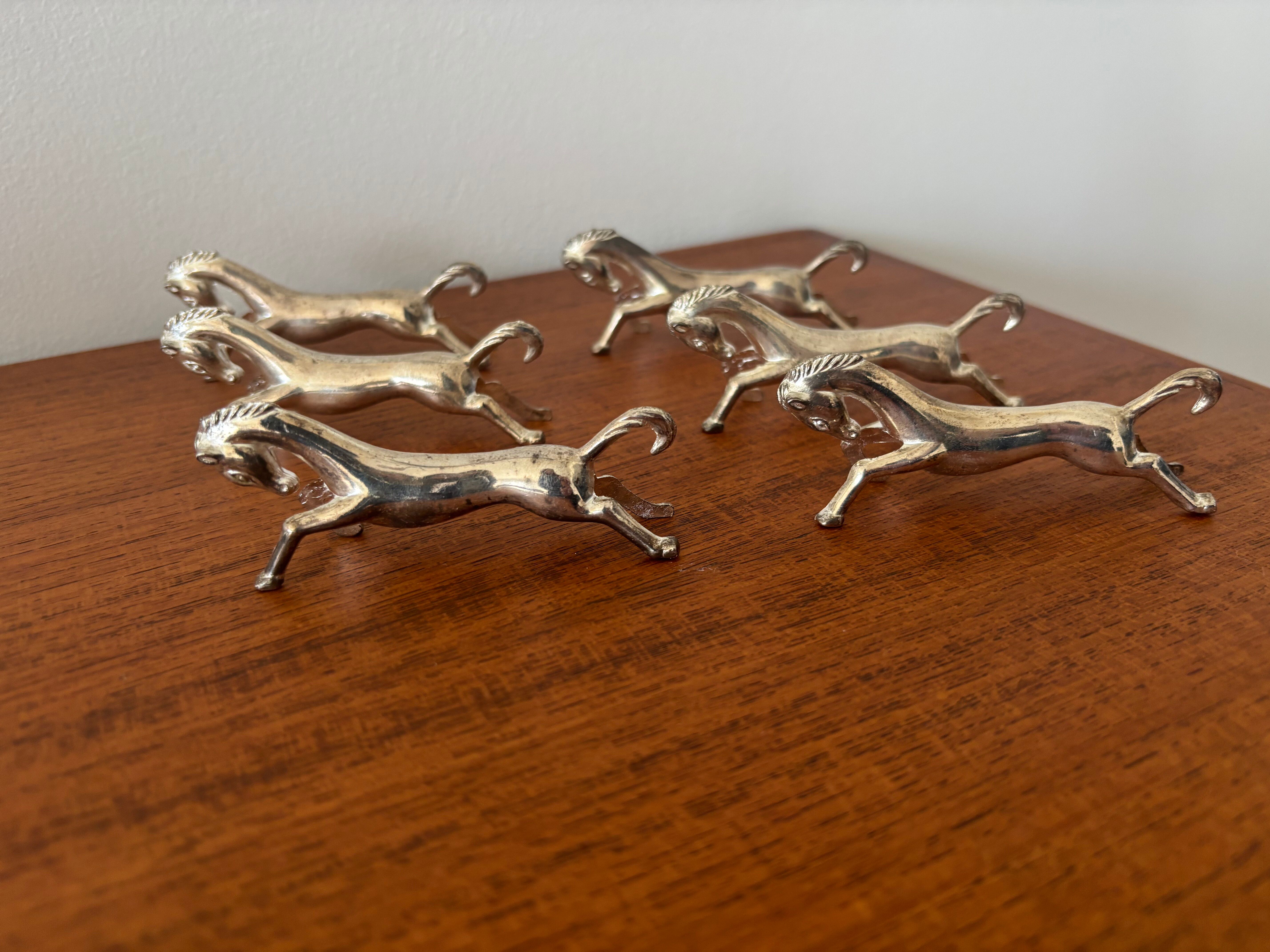 Set of 6 vintage galloping horse knife rests in silver-plated metal.