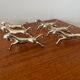 Set of 6 vintage galloping horse knife rests in silver-plated metal.