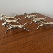 Set of 6 vintage galloping horse knife rests in silver-plated metal.