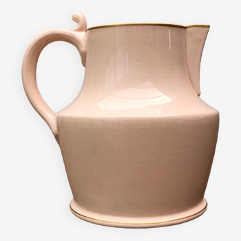 Antique pitcher in pink ceramic